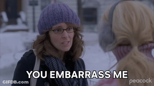 Woman In Purple Hat And Scarf Saying You Embarrass Me GIF
