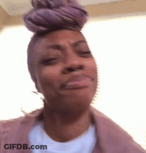 Woman In Purple Headband Making Funny Face GIF