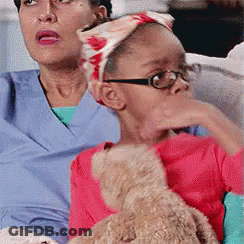 Woman In Purple Headband Making Funny Face GIF