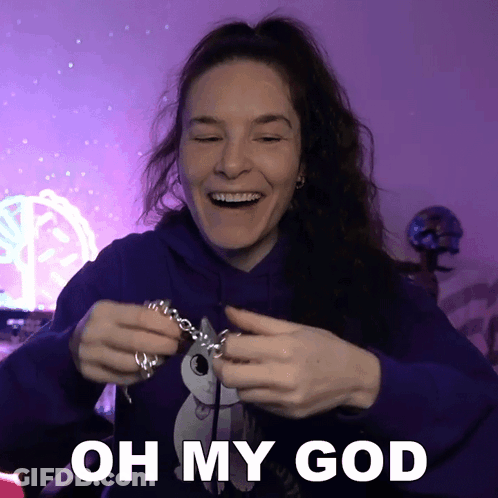 Woman In Purple Hoodie Holding Necklace Oh My God GIF