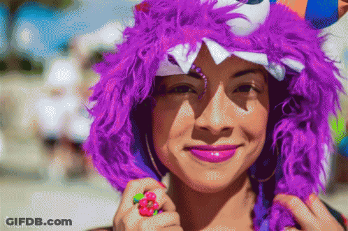 Woman In Purple Horned Hat With Flower Ring GIF