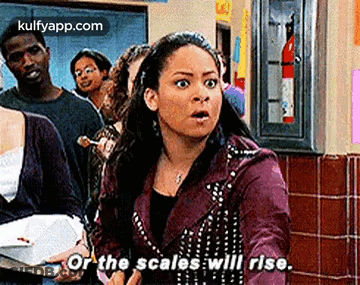 Woman In Purple Jacket Holding Box And Book In Line GIF