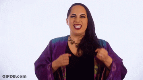 Woman In Purple Jacket Making Funny Face GIF
