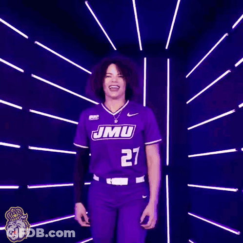 Woman In Purple JMU Softball Jersey Smiling GIF