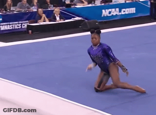 Woman In Purple Leotard Doing Trick In Front Of NCAA.com Sign GIF