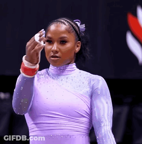 Woman In Purple Leotard Wiping Face GIF