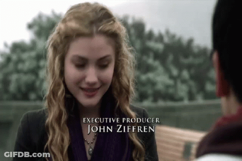 Woman In Purple Scarf Smiling Executive Producer John Zifferen GIF