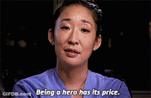 Woman In Purple Scrub Top Saying Being A Hero Has Its Price GIF