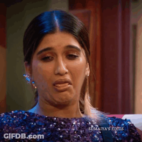 Woman In Purple Sequined Top And Earrings GIF