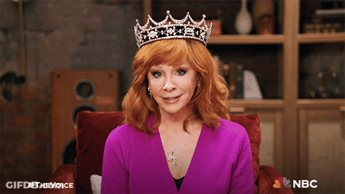 Woman In Purple Shirt And Tiara With NBC Logo GIF