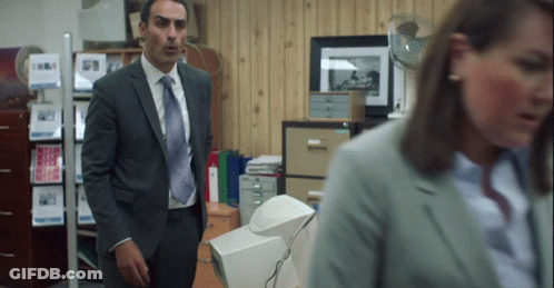 Woman In Purple Shirt And Tie With Folded Hands GIF
