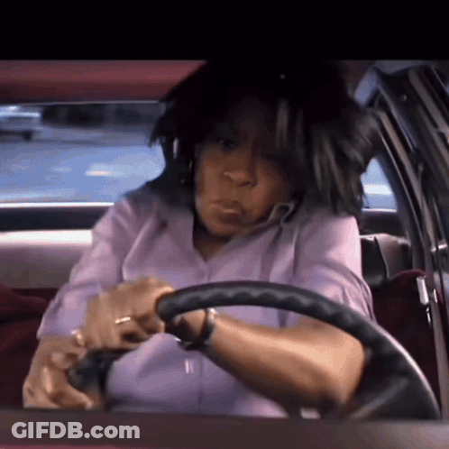 Woman In Purple Shirt Driving Car GIF