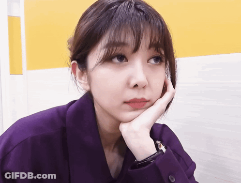 Woman In Purple Shirt Hand On Face GIF