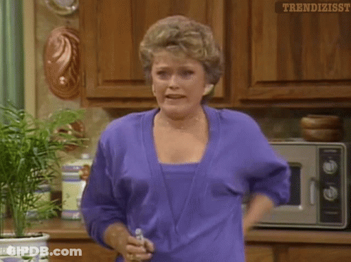 Woman In Purple Shirt Holding Water Bottle GIF
