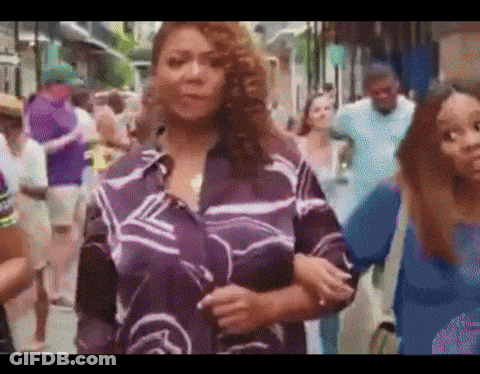 Woman In Purple Shirt In Crowd GIF