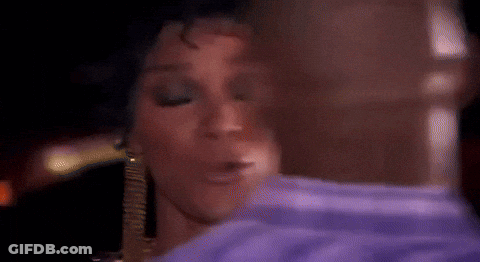 Woman In Purple Shirt Kissing Man In Blue Shirt GIF