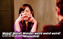 Woman In Purple Shirt Making Face Talking To Man In Suit GIF