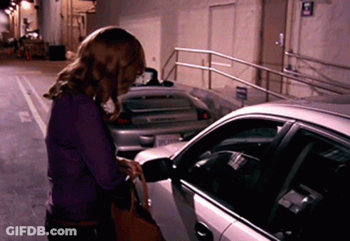 Woman In Purple Shirt Next To Car GIF