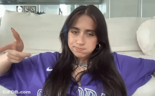 Woman In Purple Shirt Pointing At Camera GIF