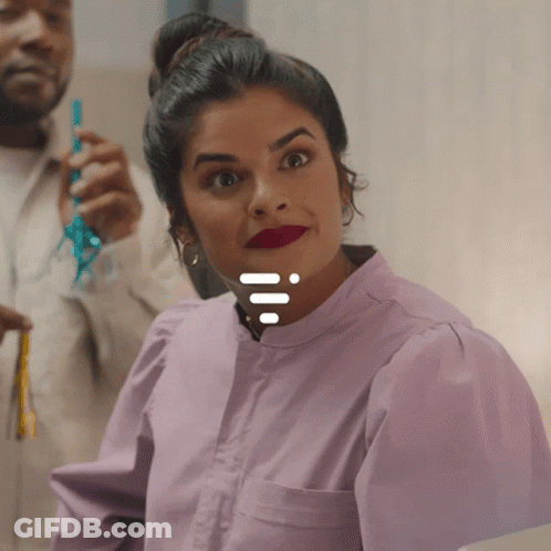 Woman In Purple Shirt Smiling With Man Holding Blue Ribbon GIF