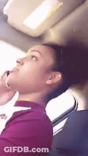 Woman In Purple Shirt Talking On Phone GIF