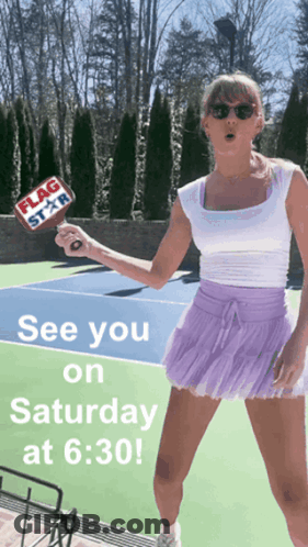 Woman In Purple Skirt Holding Flag Star Paddle On Tennis Court GIF