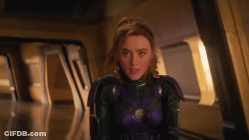 Woman In Purple Suit Standing In Doorway GIF