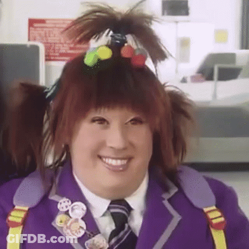 Woman In Purple Suit Tie Ponytail Smiling GIF