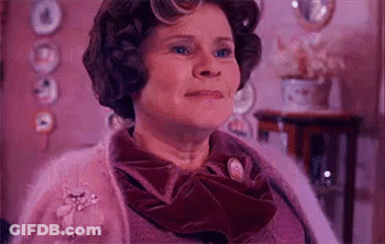 Woman In Purple Sweater And Bow Tie GIF