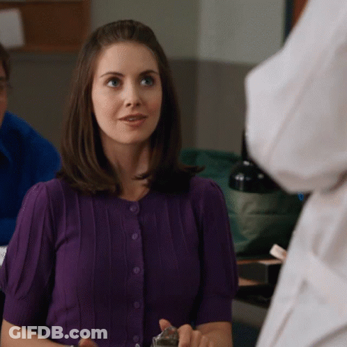 Woman In Purple Sweater Looking GIF