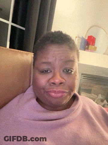 Woman In Purple Sweater Sitting On Couch GIF
