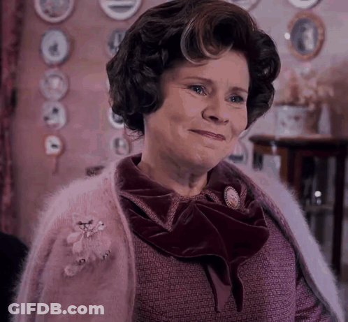 Woman In Purple Sweater Smiling GIF
