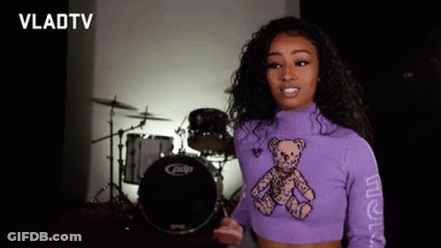 Woman In Purple Sweater With Teddy Bear GIF