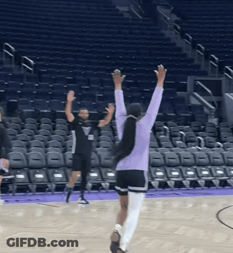 Woman In Purple Sweatshirt On Basketball Court GIF