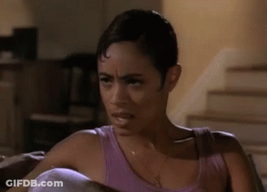 Woman In Purple Tank Top Making Face GIF