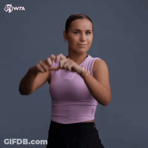Woman In Purple Tank Top Making Heart Shape GIF