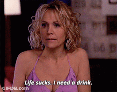 Woman In Purple Top Saying Life Sucks I Need A Drink GIF
