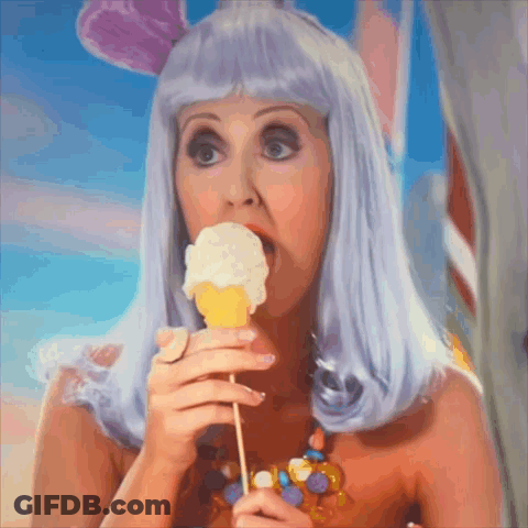 Woman In Purple Wig Eating Ice Cream GIF