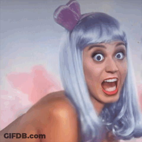 Woman In Purple Wig With Bow GIF