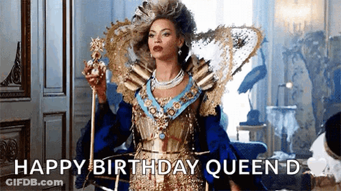 Woman In Queen Costume Holding Crown And Cane GIF