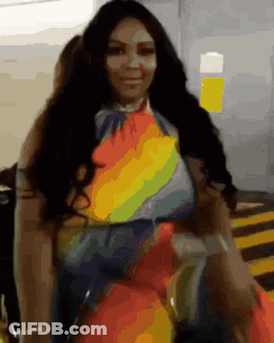 Woman In Rainbow Dress In Parking Garage GIF