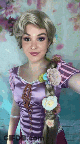 Woman In Rapunzel Costume With Flowers In Hair GIF