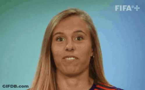 Woman In Red 19 Jersey Smiling Next To Woman In Yellow GIF