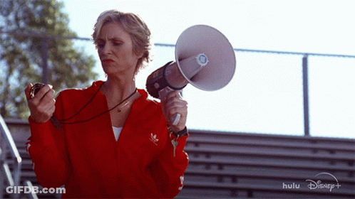 Woman In Red Adidas Jacket Holding Megaphone GIF