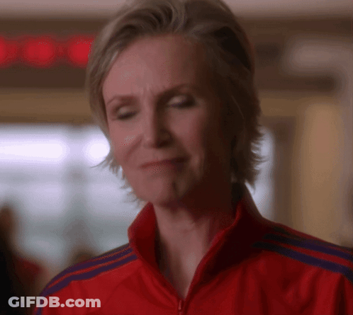 Woman In Red Adidas Jacket Looking Down GIF