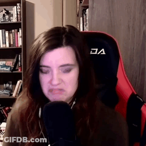 Woman In Red And Black Chair With V GIF
