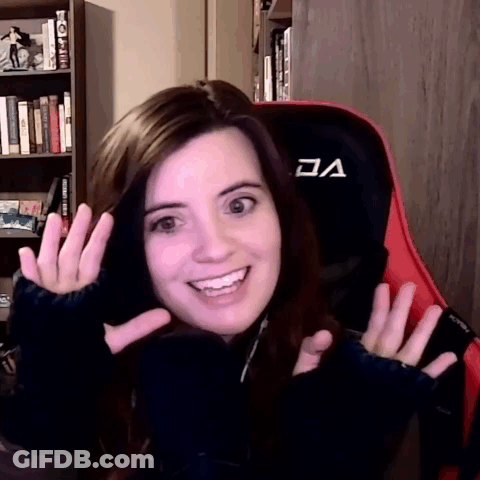 Woman In Red And Black Gaming Chair With Letter A GIF