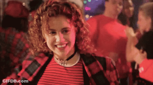 Woman In Red And Black Striped Shirt Smiling GIF