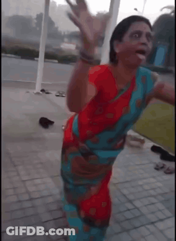 Woman In Red And Blue Dress Dancing GIF