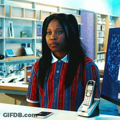 Woman In Red And Blue Striped Shirt At Desk With Siemens Phone GIF